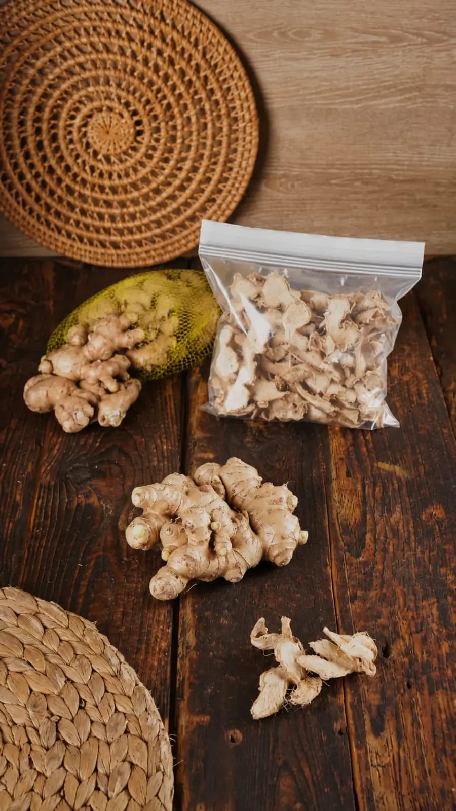 Jahe Gajah and bagged dried ginger arranged on a wooden table